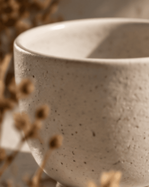 Japanese-style ceramic cup on light oak